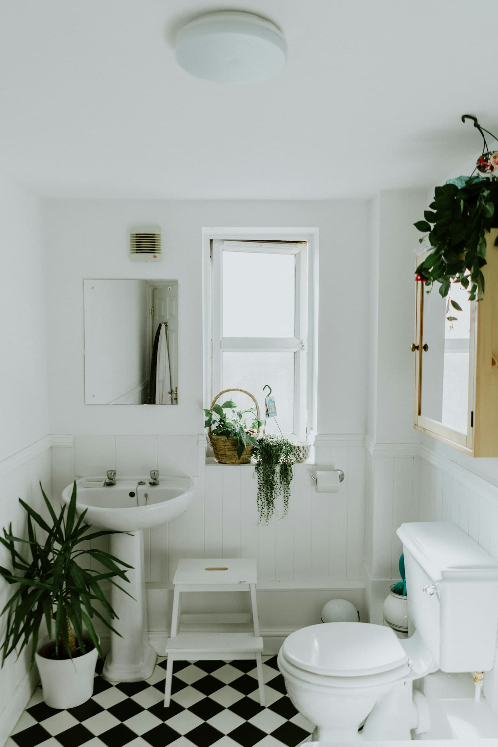 Pristine modern white bathroom — tiles, grout, and fixtures cleaned